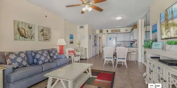 Image 4: Living room featuring a ceiling fan and light tile patterned floors
