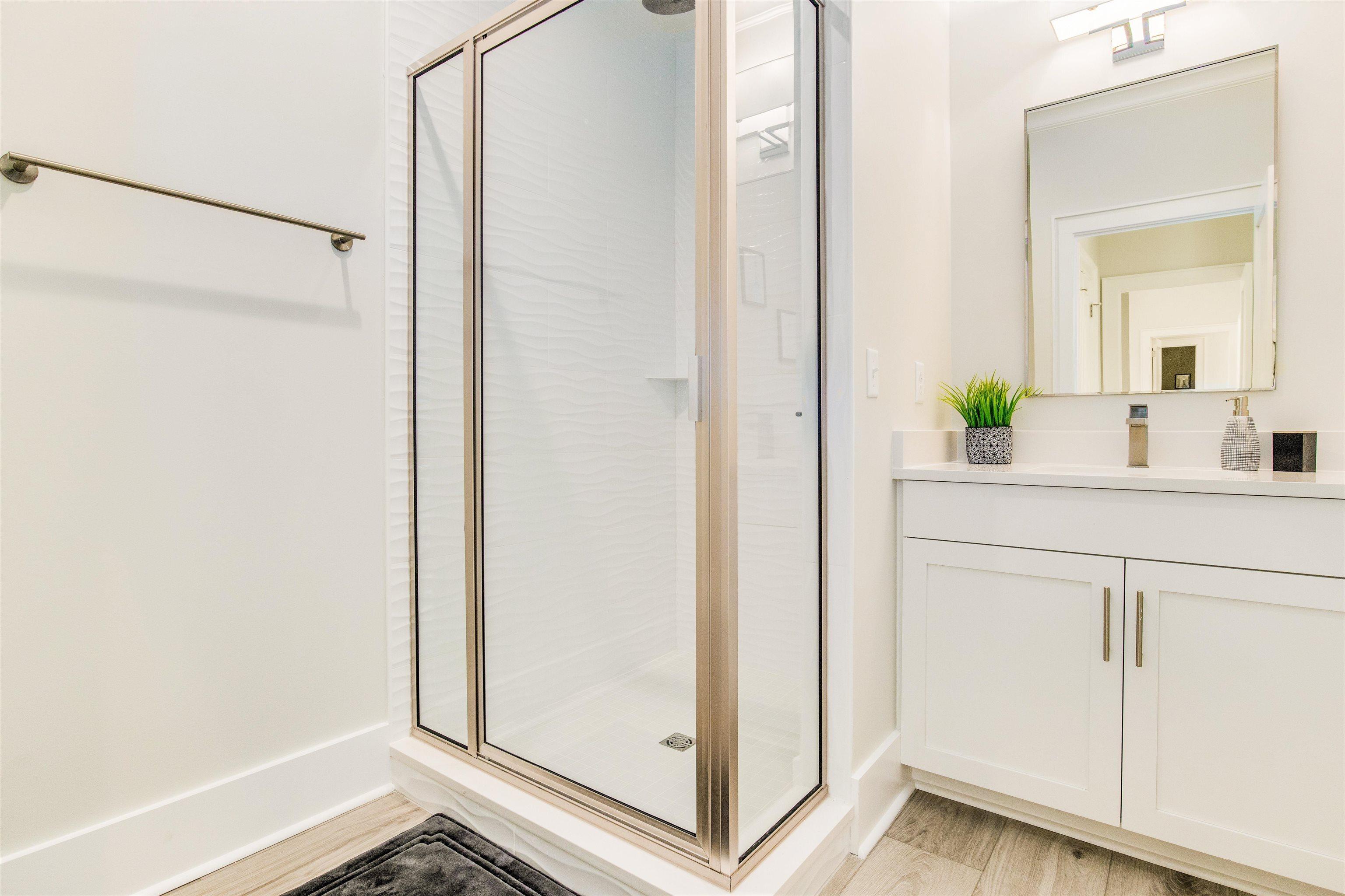 Image 4: Full bath with a shower stall and vanity