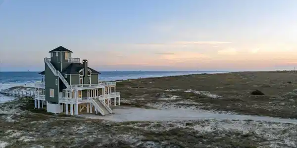 Image 4: Elevated coastal residence featuring multiple balconies and a prominent observation tower