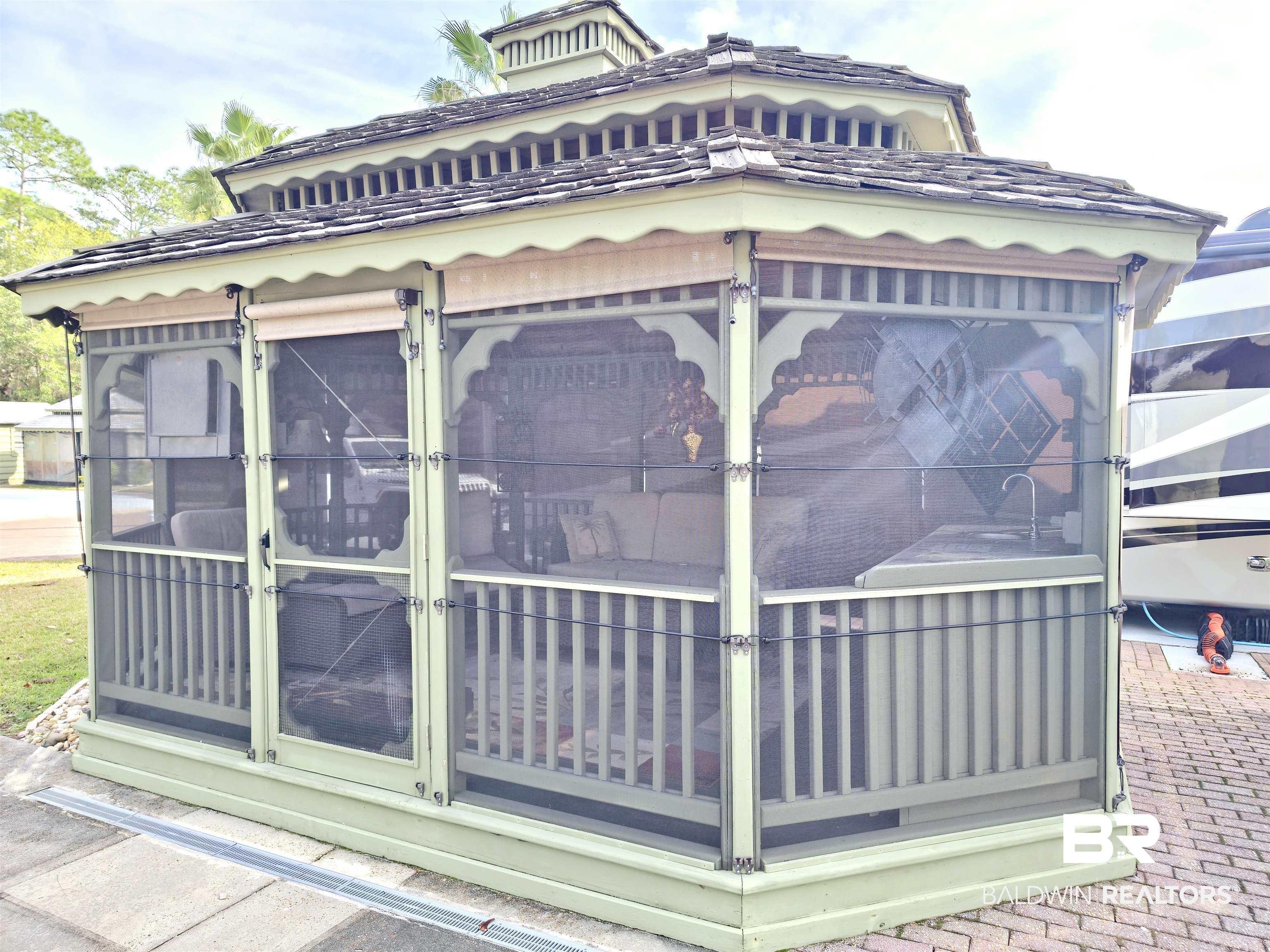 Image 2: View of property exterior featuring a sunroom
