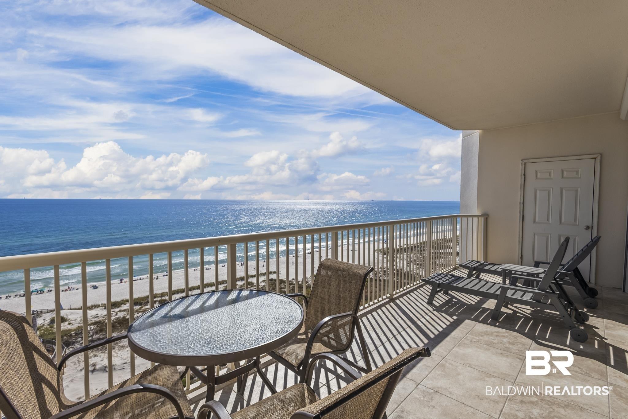 Image 2: Balcony with view of water and beach
