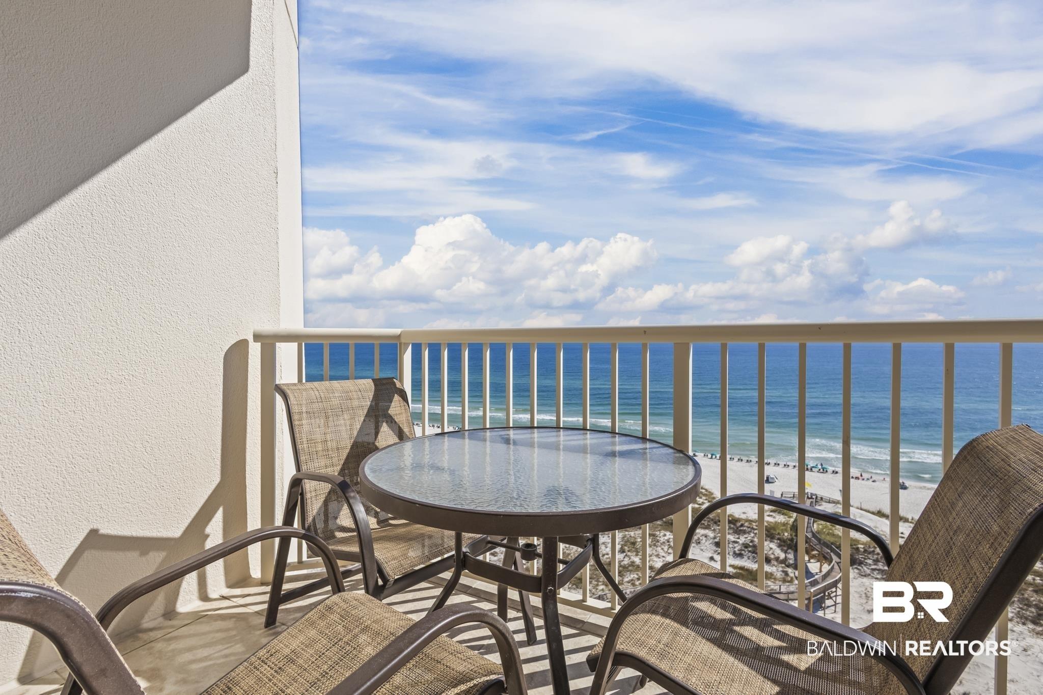 Image 3: Balcony with view of water and beach