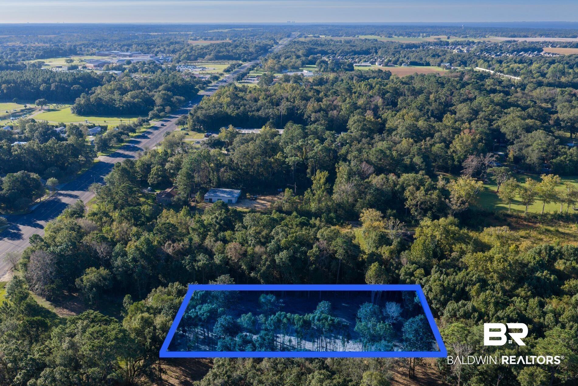 Image 4: Aerial overview of property's location featuring property boundaries highlighted