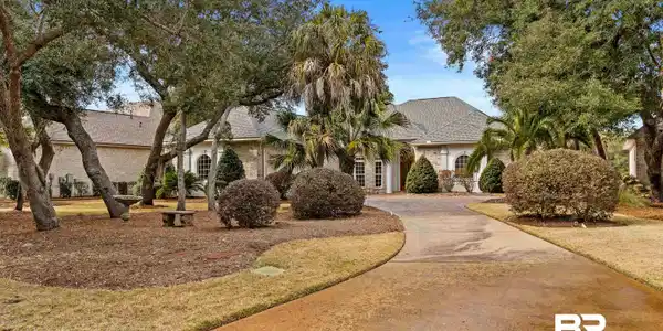 Image 3: View of front of home with driveway