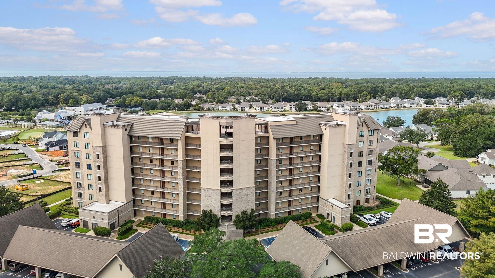 Image 1: View of apartment building / complex with a water view