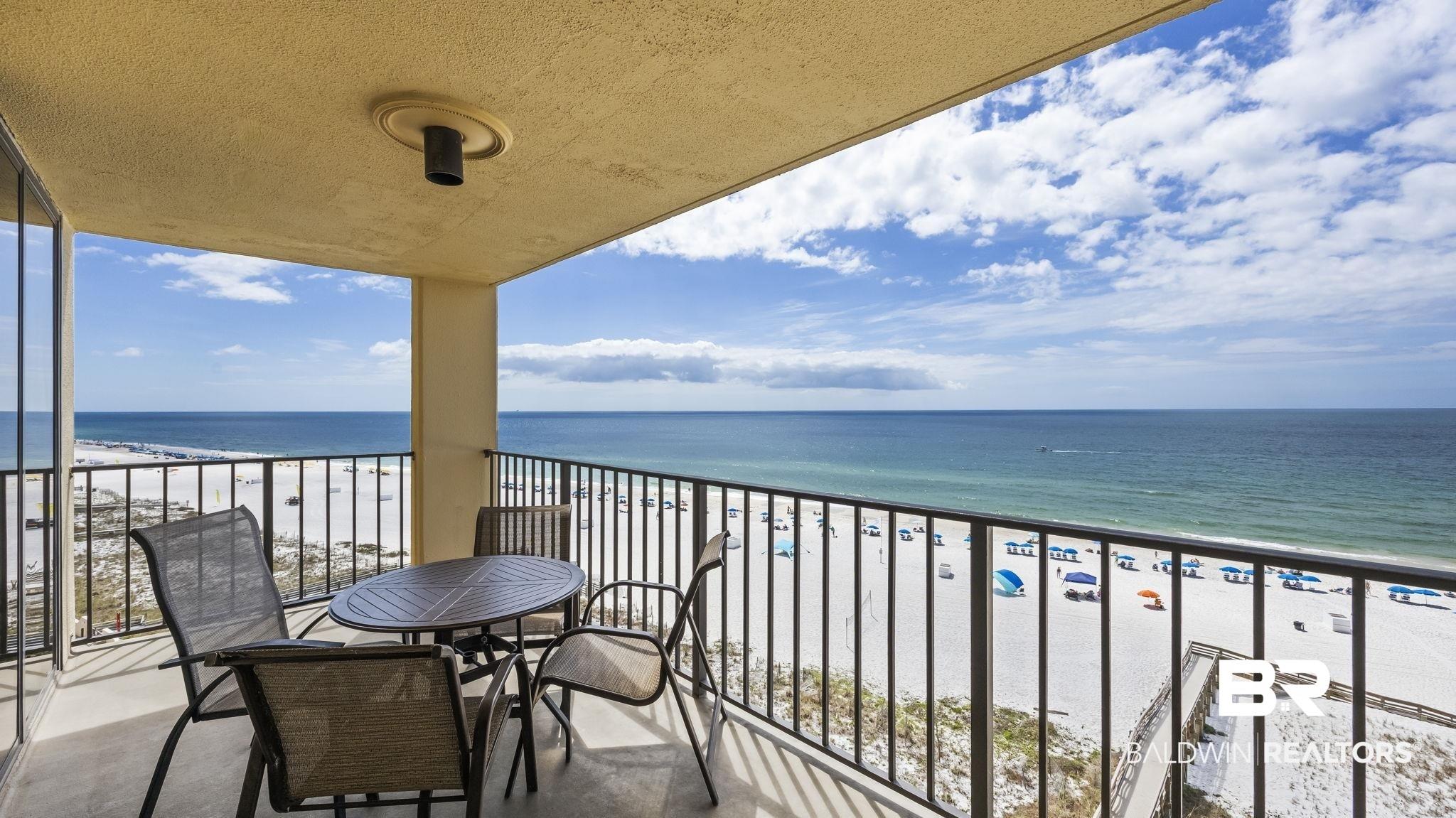 Image 2: Balcony with view of water and beach