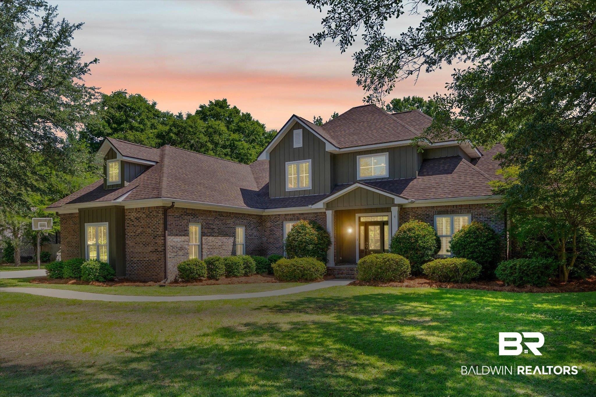 Image 2: Brick and siding exterior with a welcoming entryway