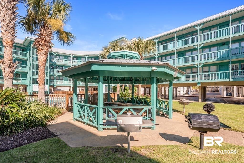 Image 4: View of home's community featuring a patio and a gazebo