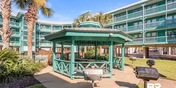Image 4: View of home's community featuring a patio and a gazebo