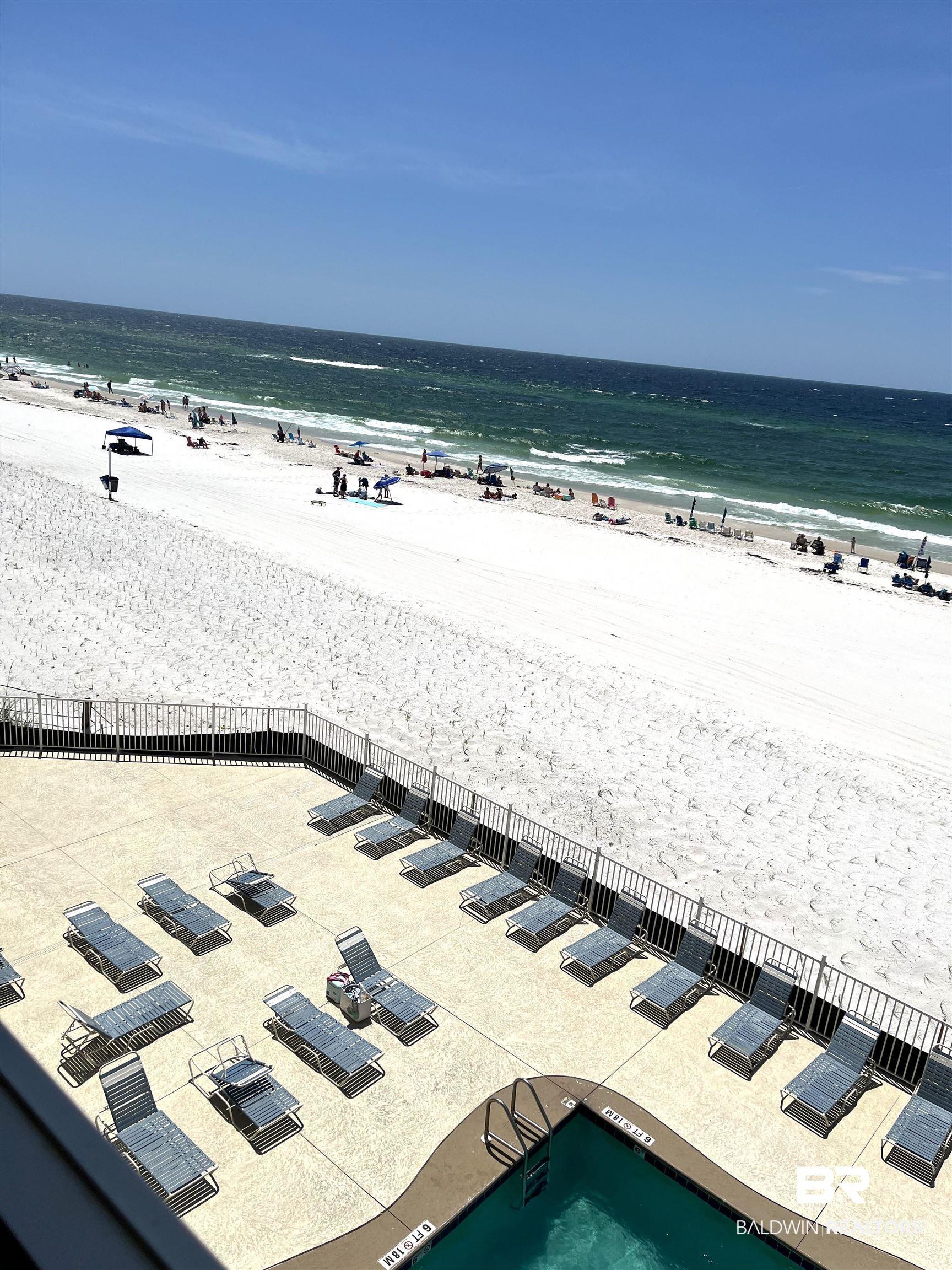 Image 3: Expansive white sand beach with turquoise water
