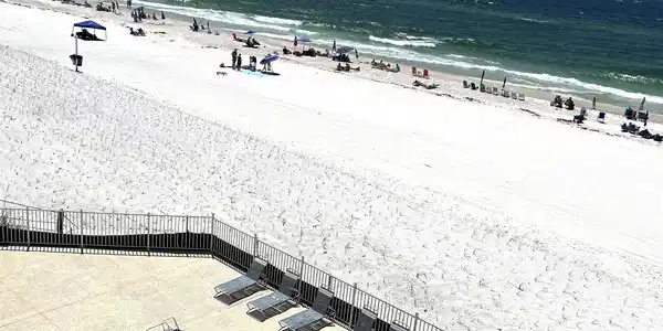 Image 3: Expansive white sand beach with turquoise water
