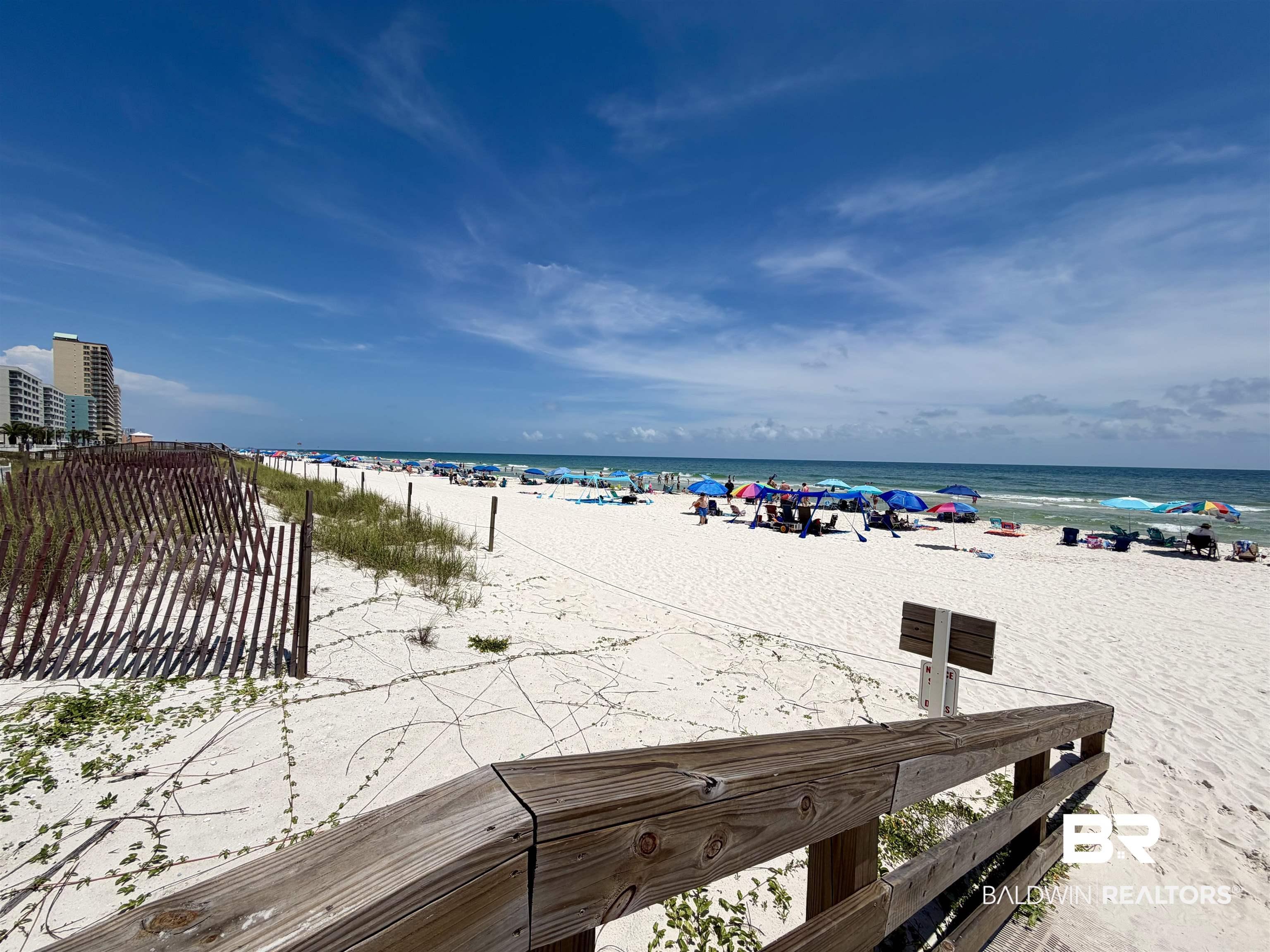 Image 4: Expansive white sand beach with turquoise waters