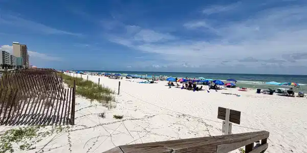 Image 4: Expansive white sand beach with turquoise waters