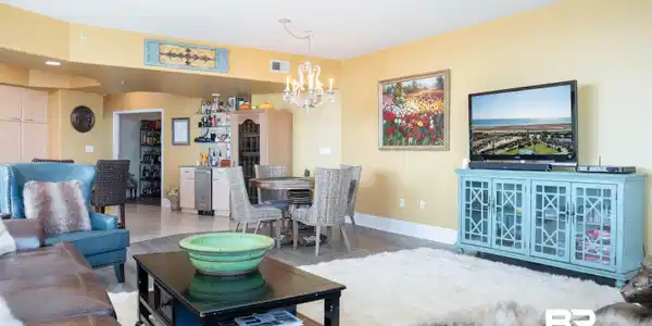 Image 3: Living room featuring wood finished floors and a chandelier