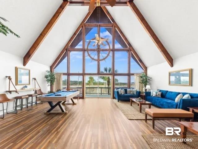 Image 3: Game room featuring billiards, wood finished floors, and plenty of natural light