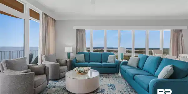 Image 4: Living room with ceiling fan, a water view, and crown molding