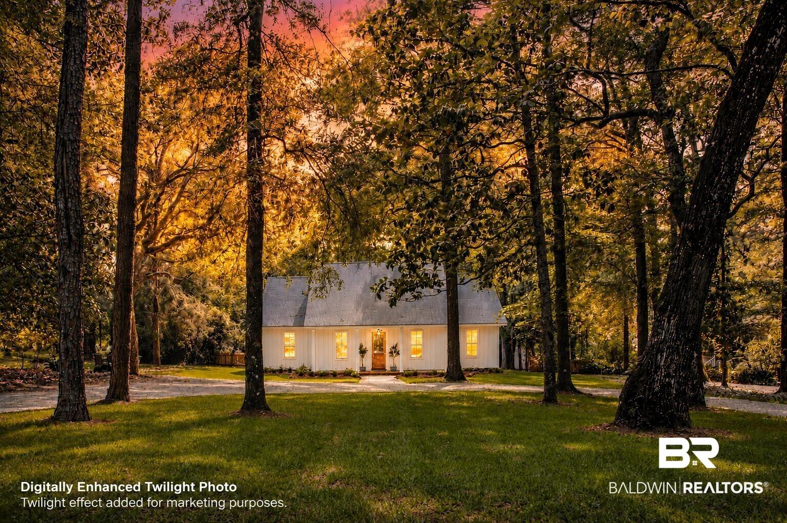 Image 4: White exterior with a light gray roof, set amidst mature trees
