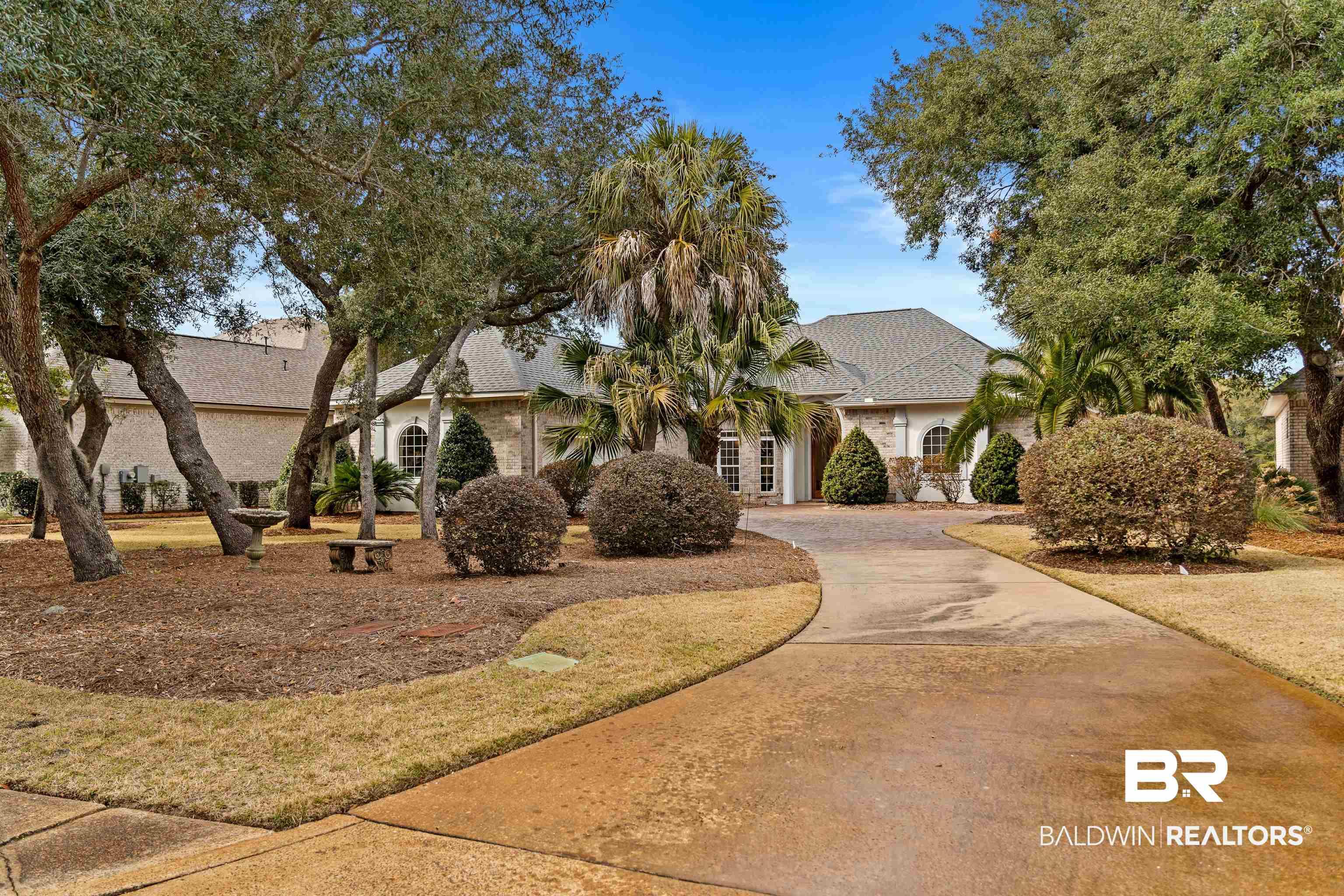 Image 3: View of front of home with driveway