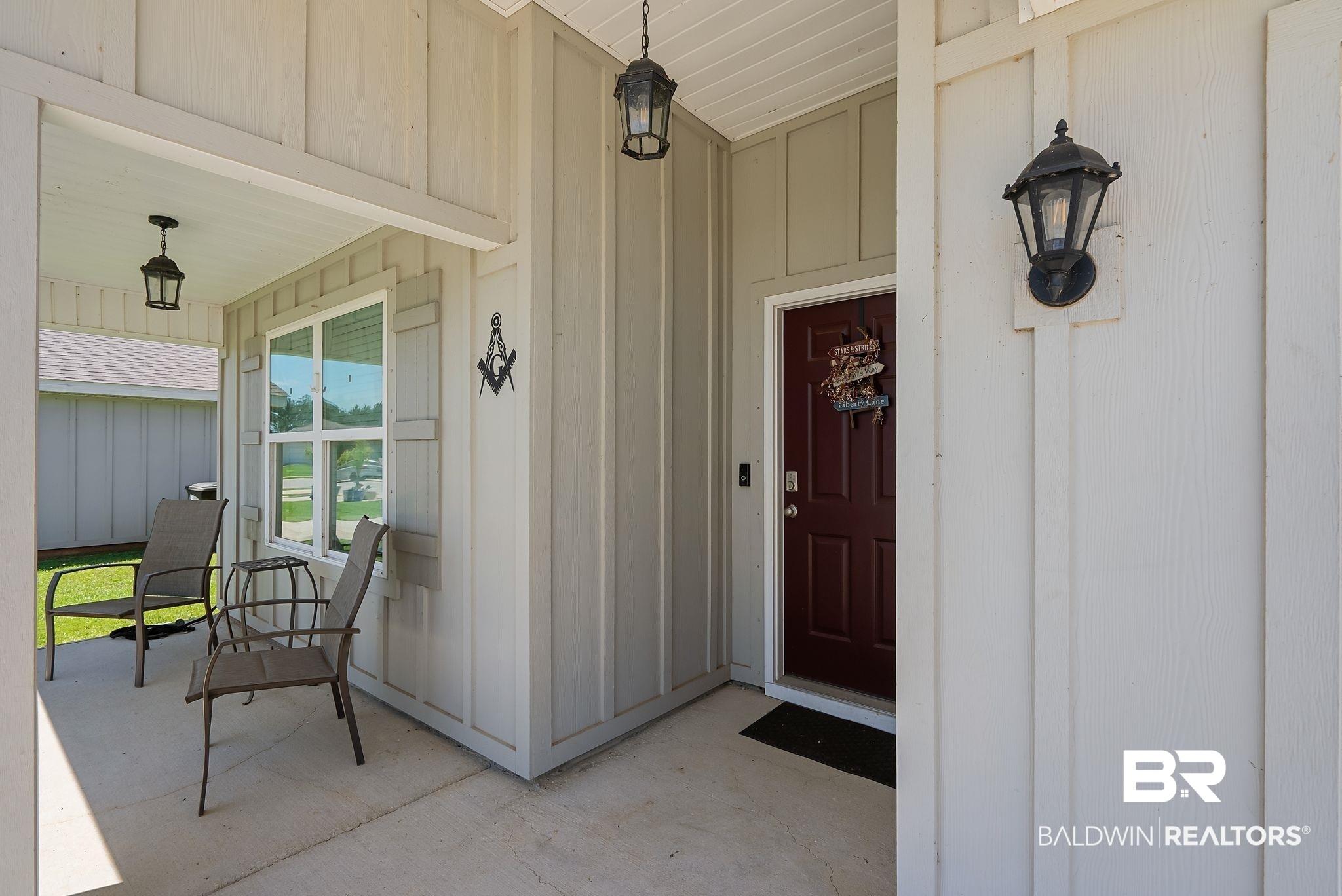 Image 4: Covered front porch featuring board and batten siding