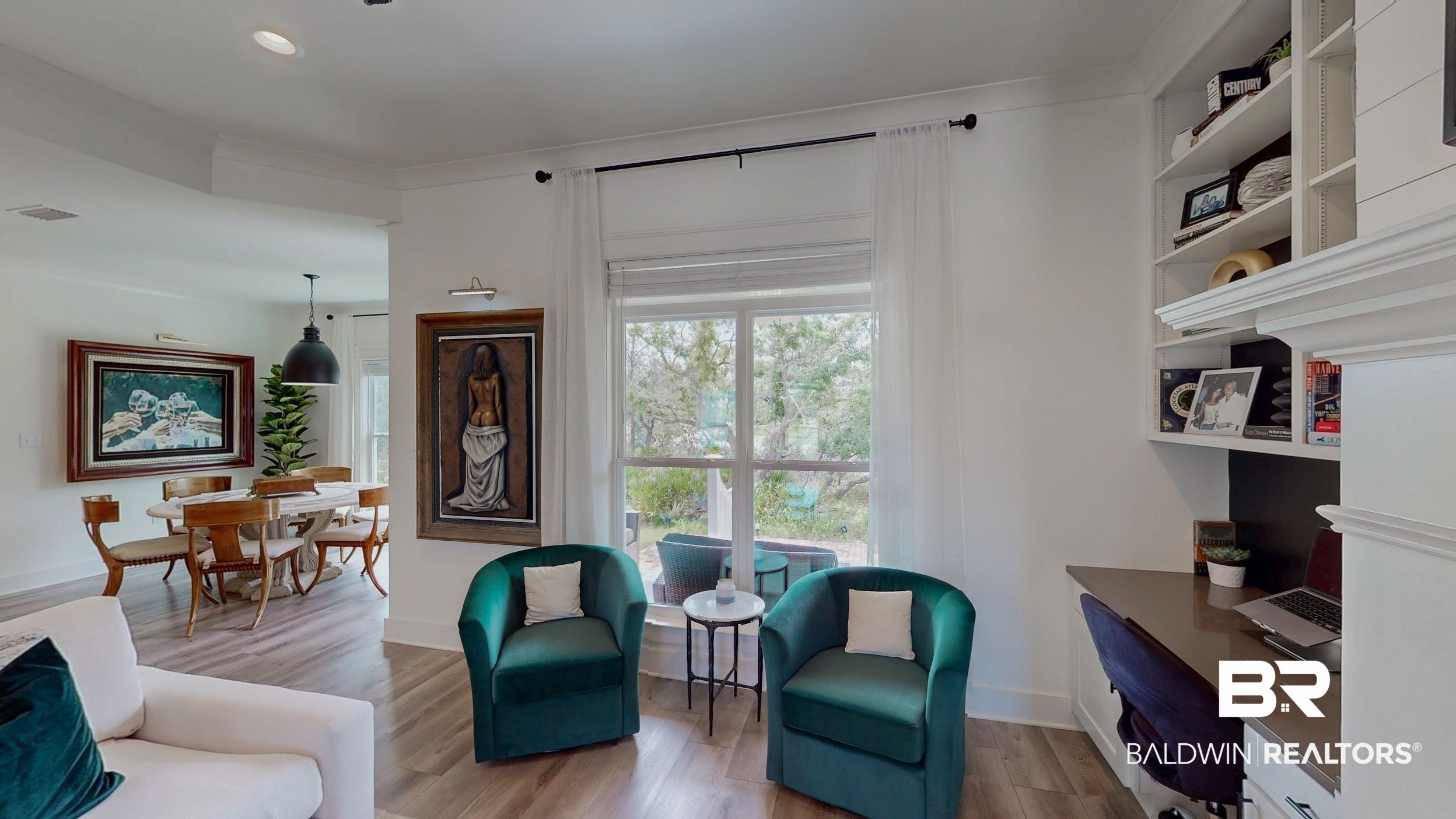 Image 4: Spacious interior featuring wood-finish flooring and white walls