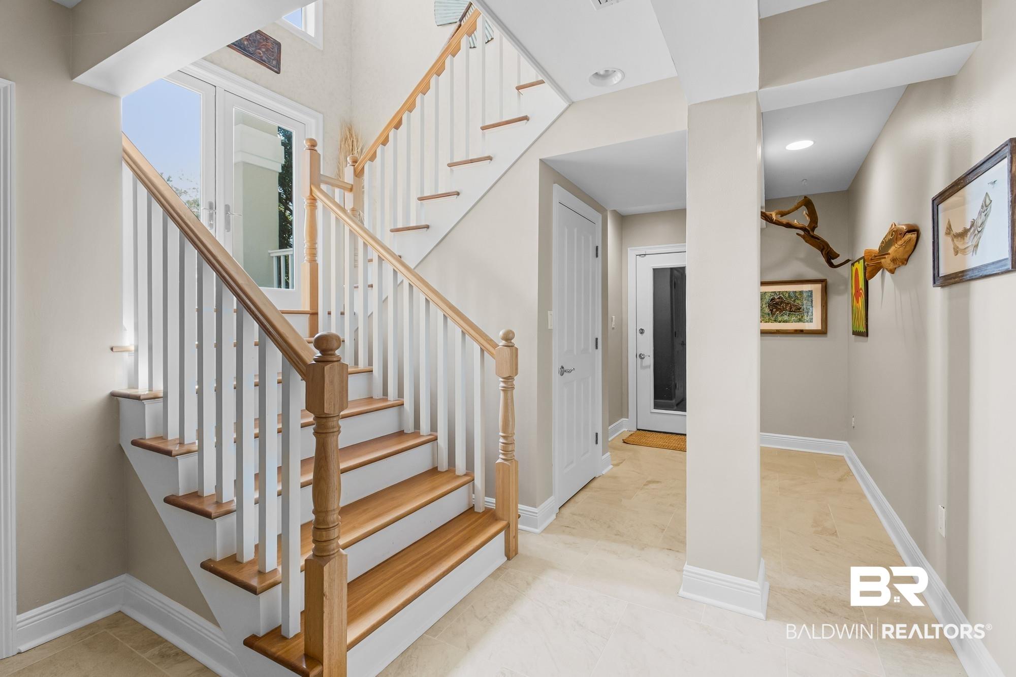 Image 3: Stairway featuring baseboards