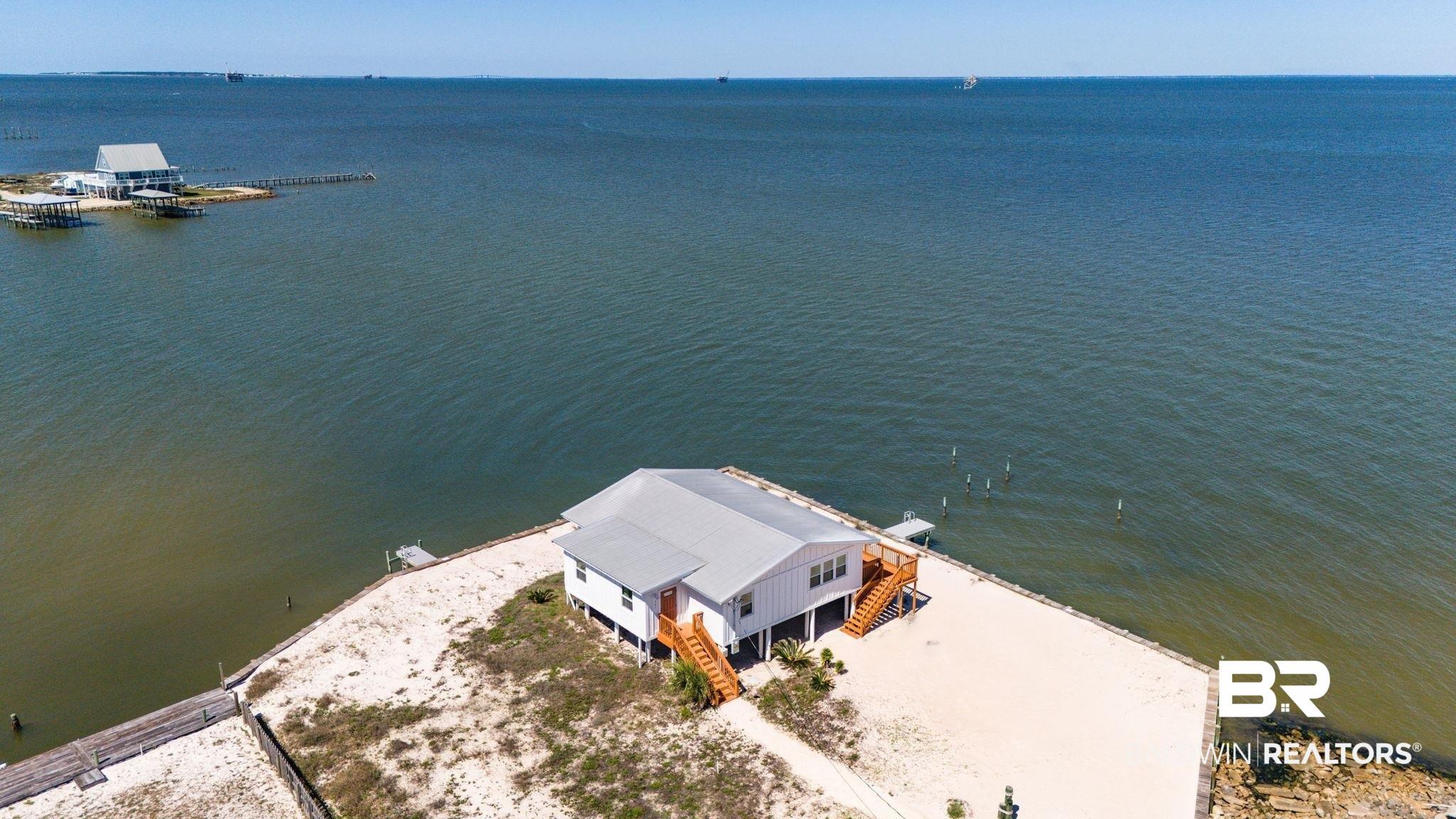 Image 4: View from above of property featuring a large body of water