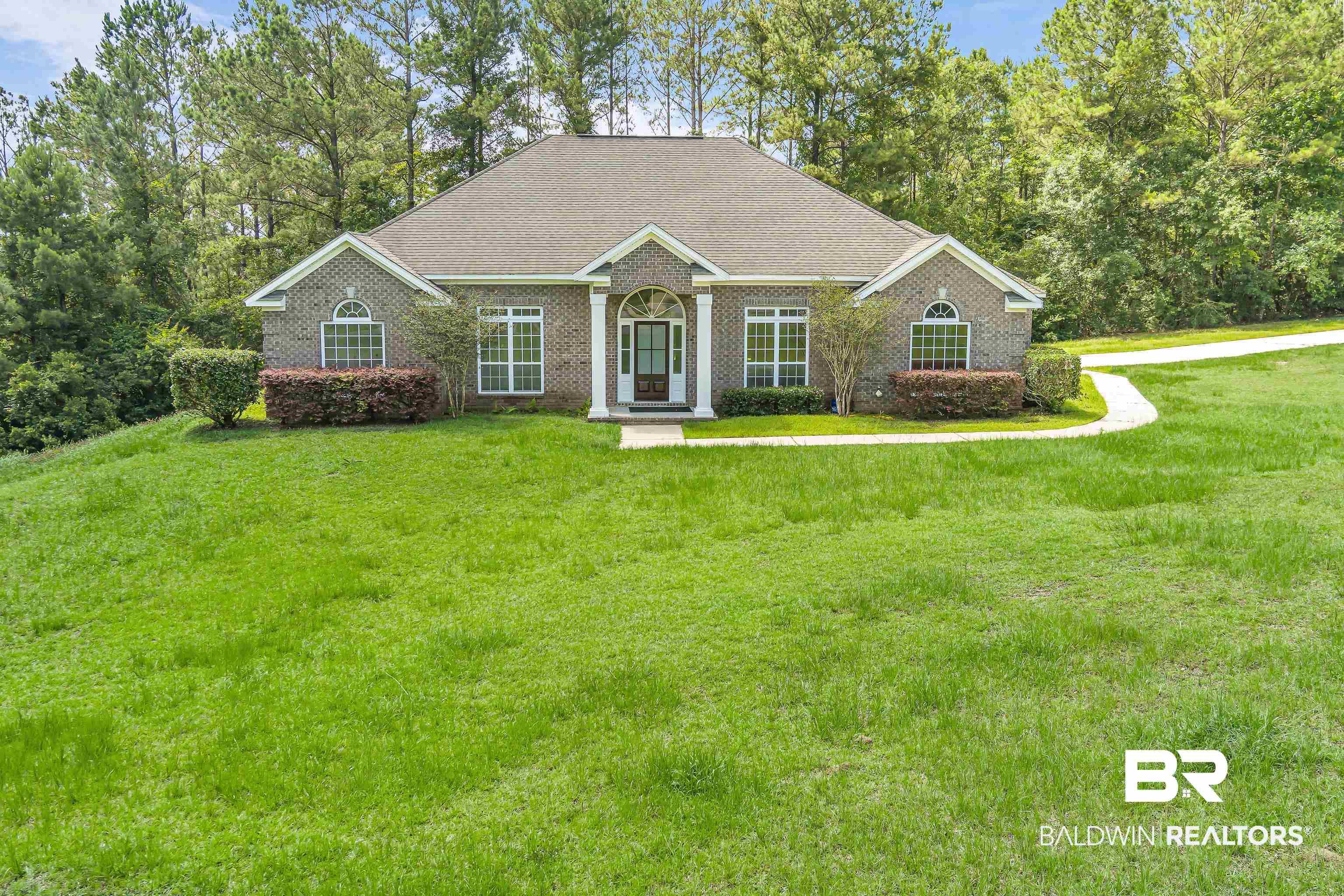 Image 2: Home faces Delta Woods Subdivision entrance