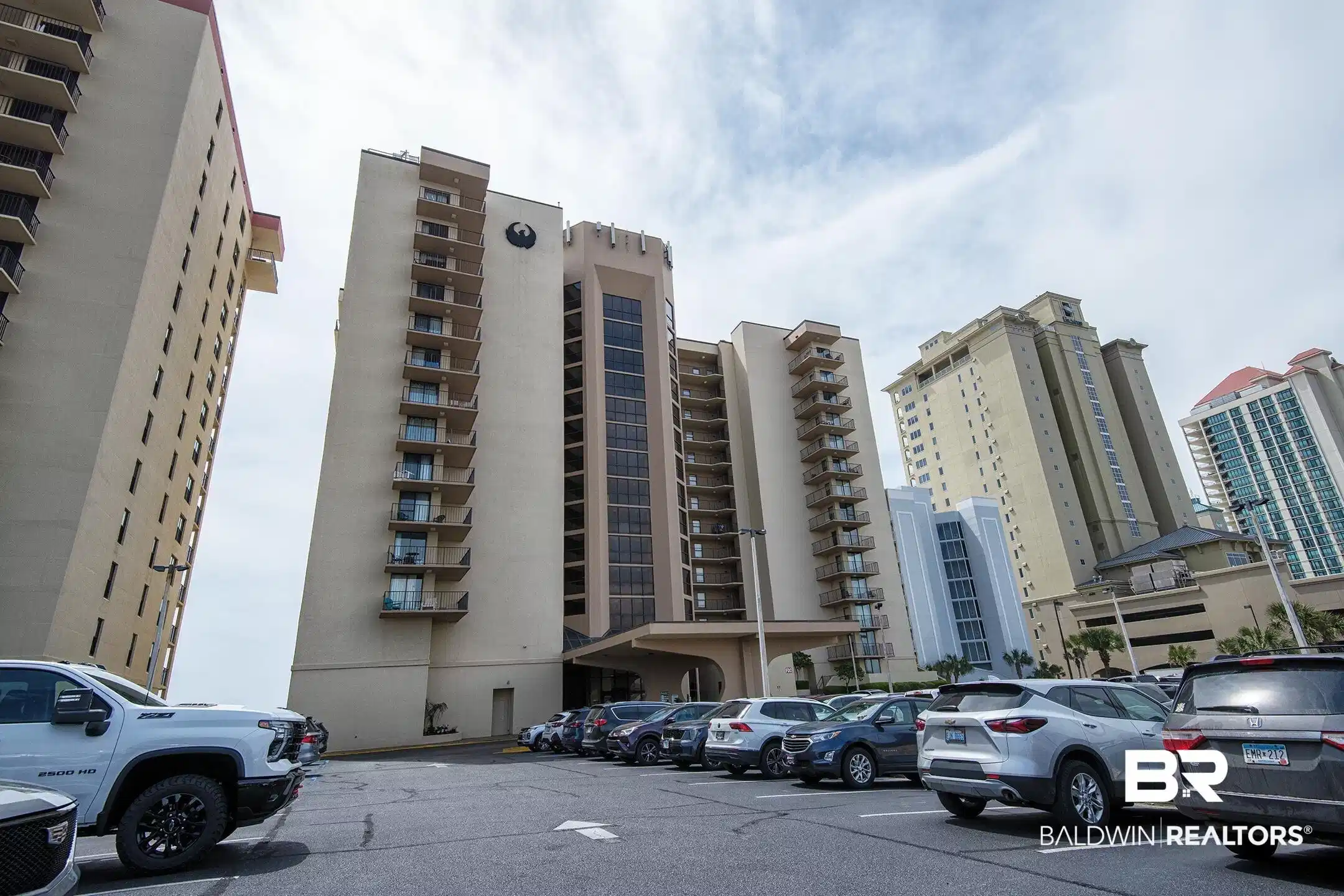 Image 1: View of apartment building / complex with uncovered parking