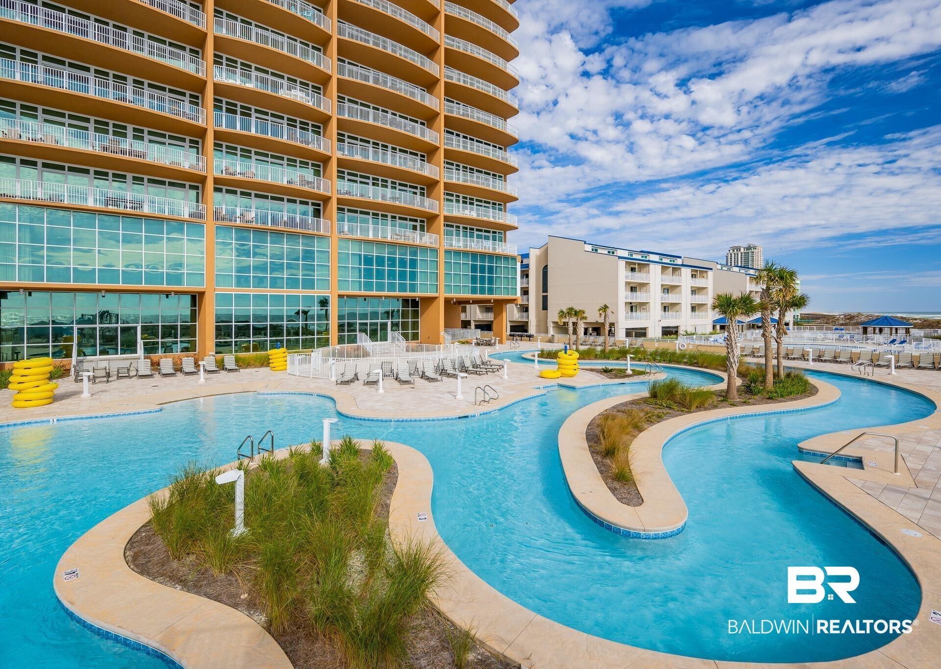 Image 3: Community pool with a patio area