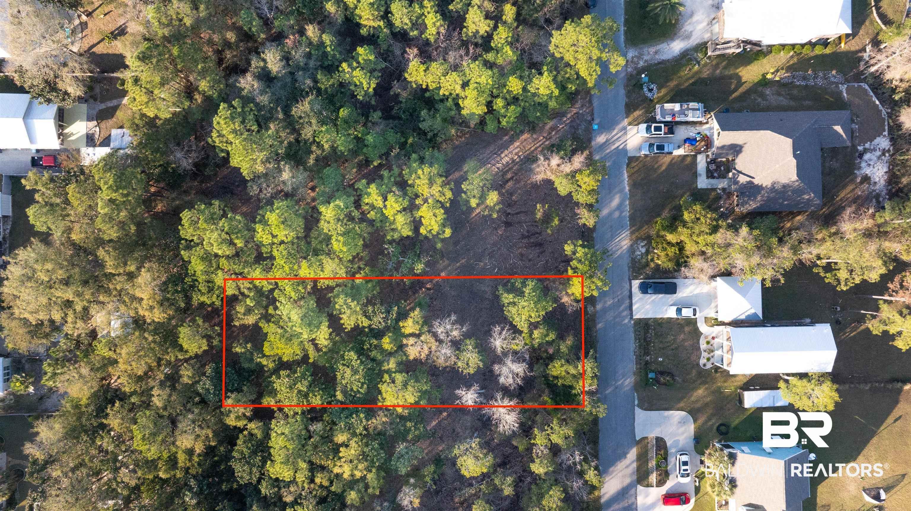 Image 1: Aerial overview of property's location featuring property boundaries highlighted