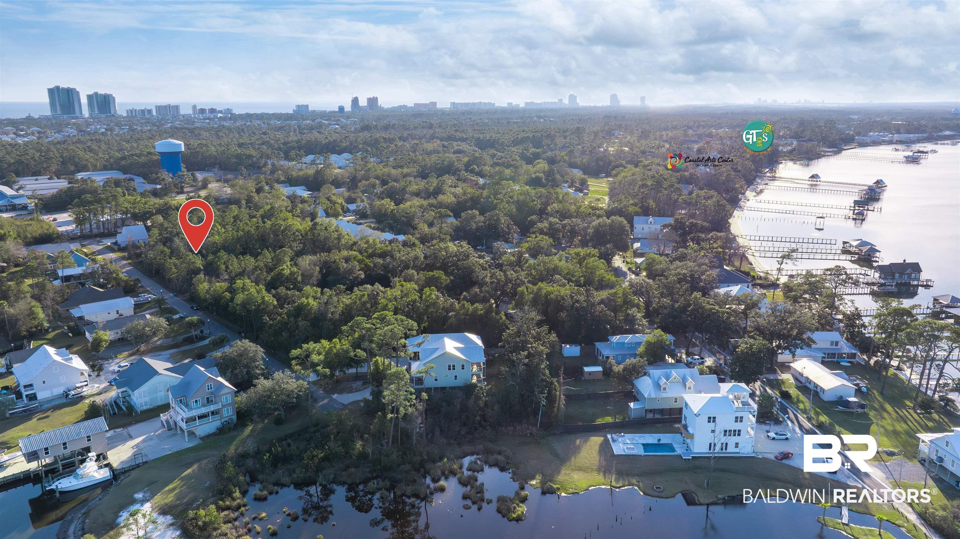 Image 4: Aerial view of property and surrounding area featuring nearby suburban area and skyline