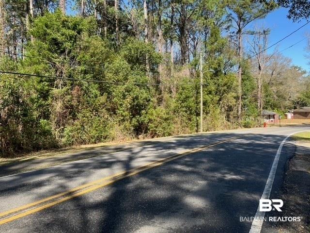 Image 3: View of road with a wooded view