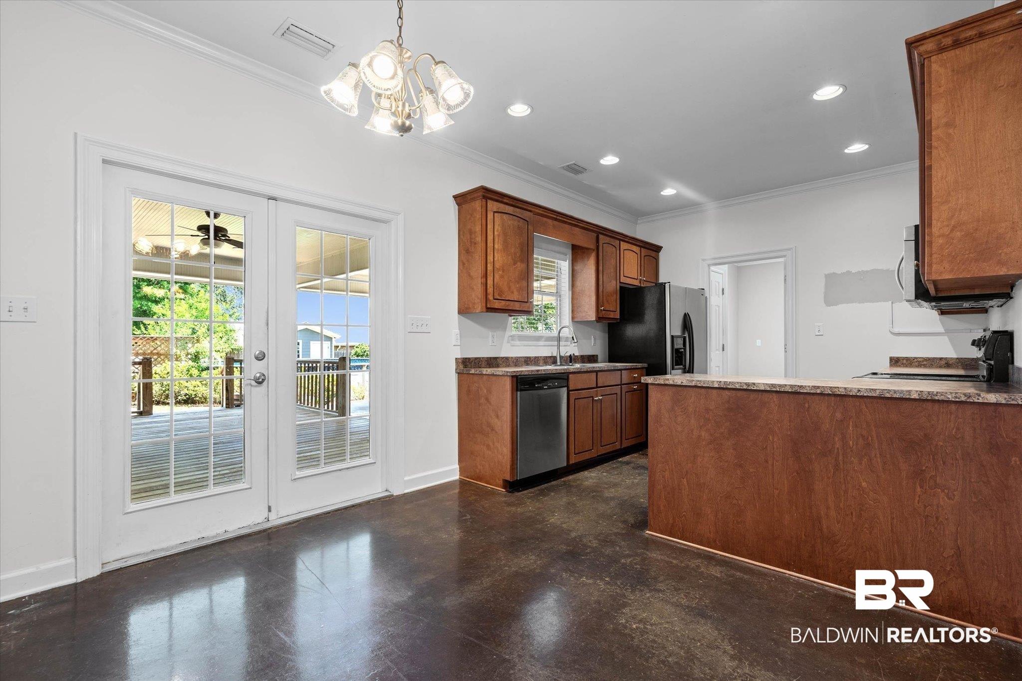 Image 4: Also, displaying French doors which lead to the covered deck.