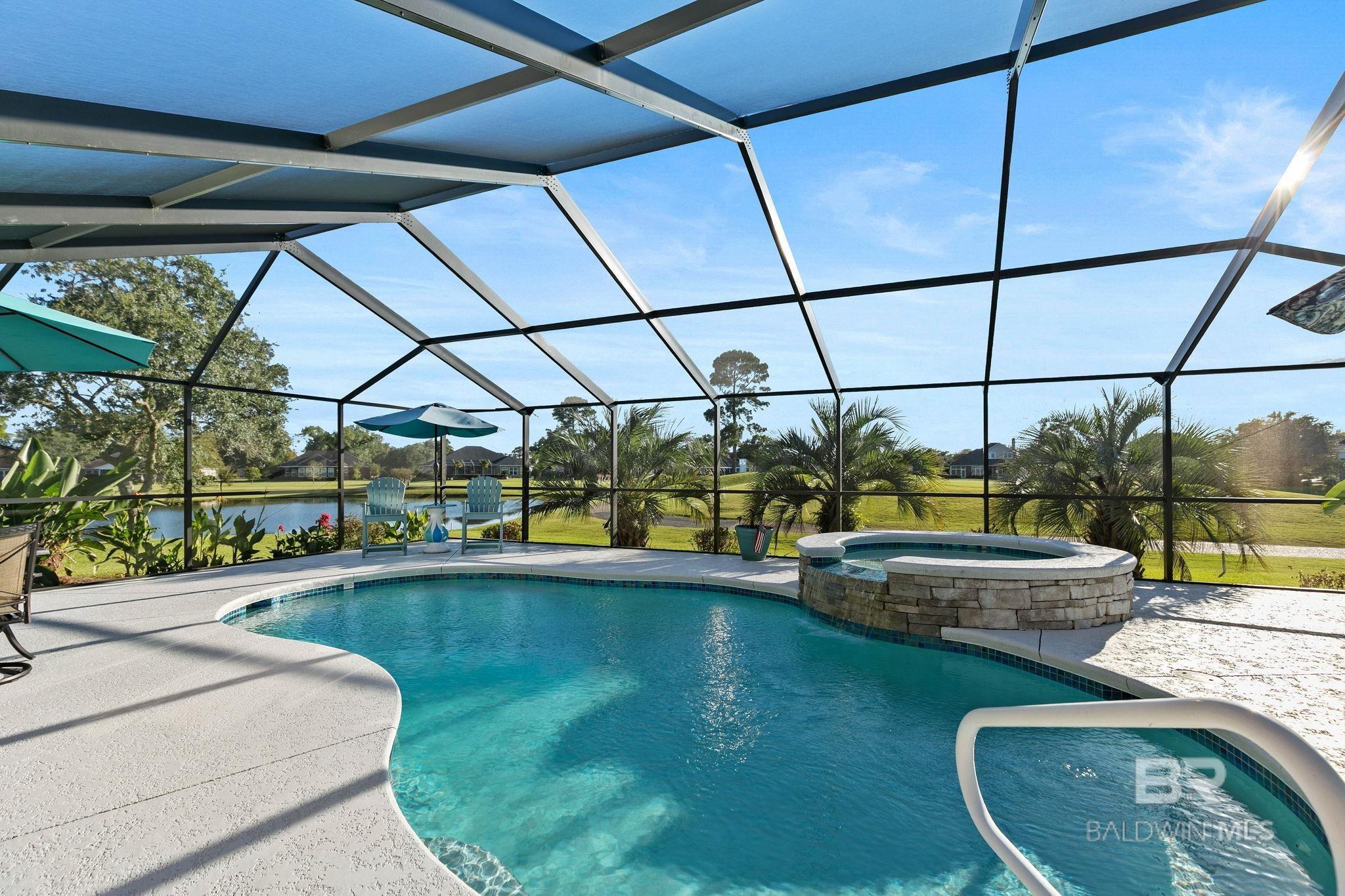 Image 2: Screened in pool and spa