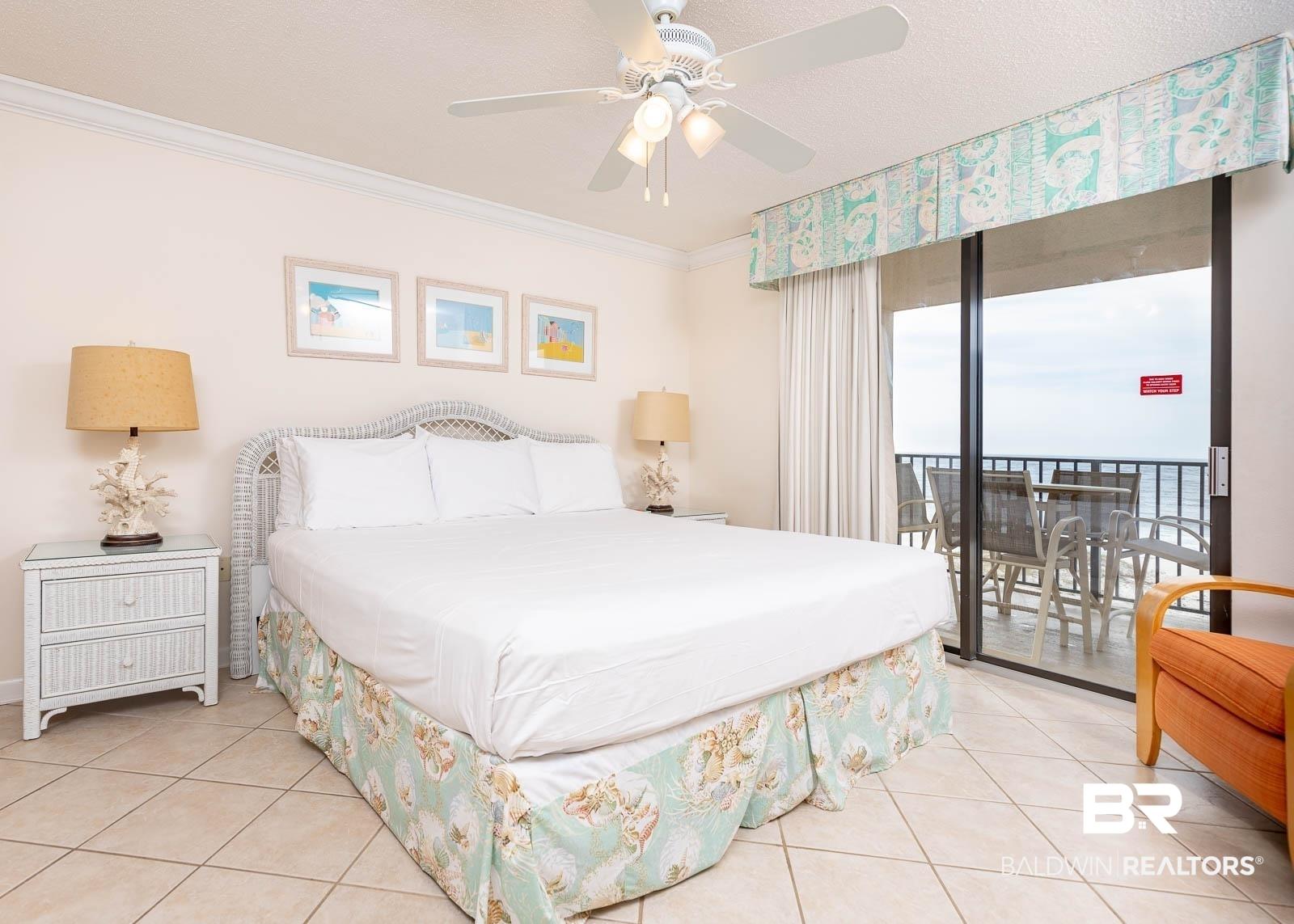 Image 2: Bedroom with access to outside, ceiling fan, crown molding, and light tile patterned floors