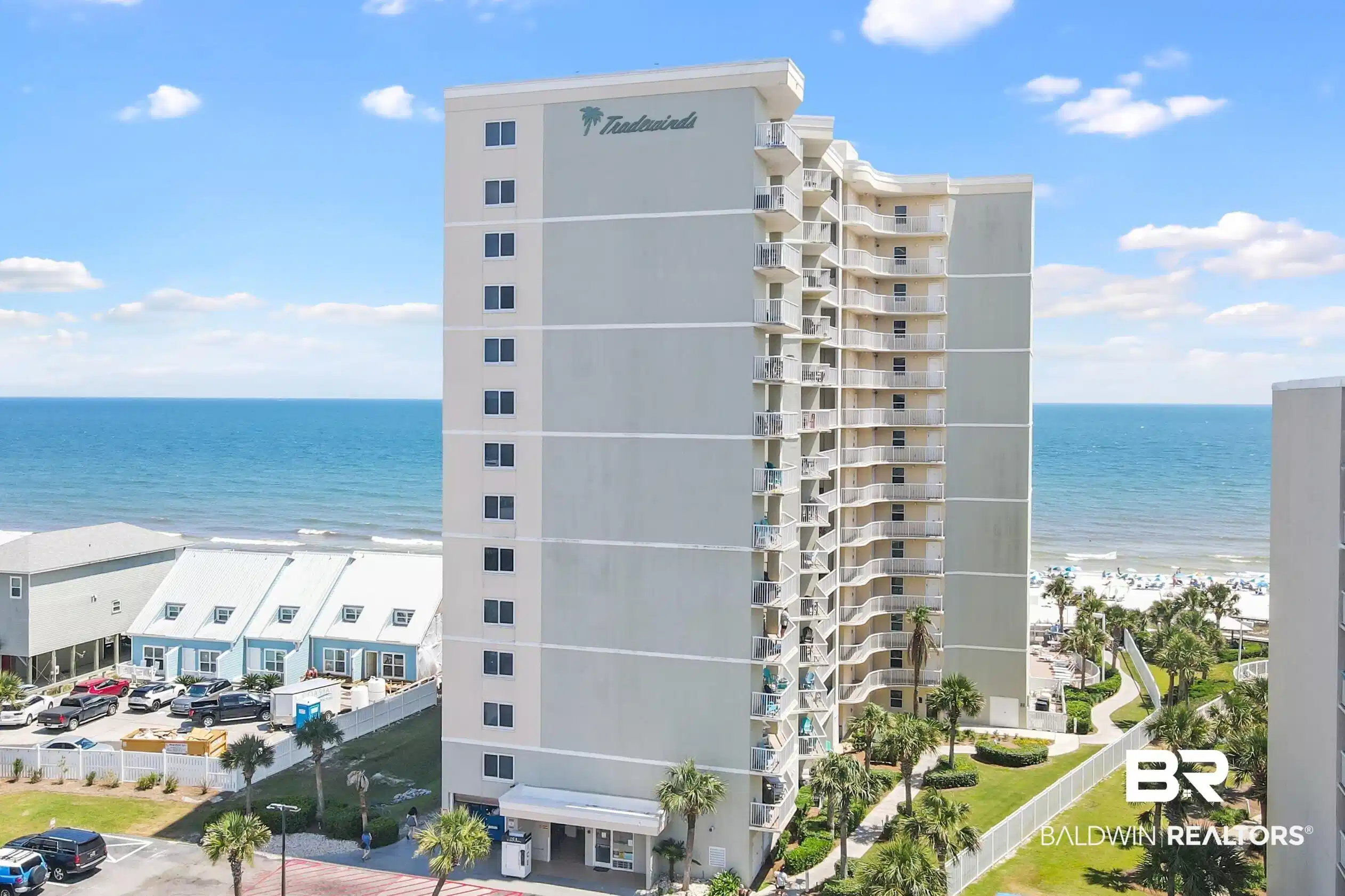 Image 1: View of apartment building / complex with view of water and beach