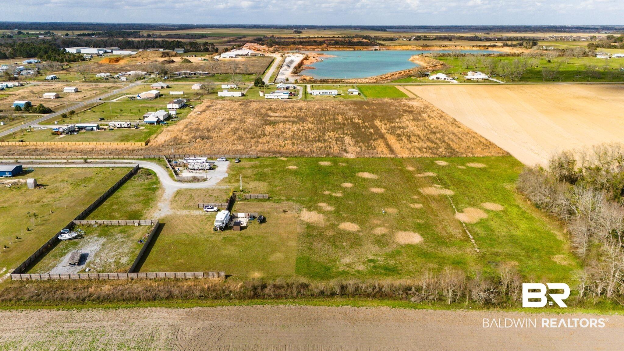 Image 4: Overview of rural landscape featuring extensive farmland and a nearby body of water