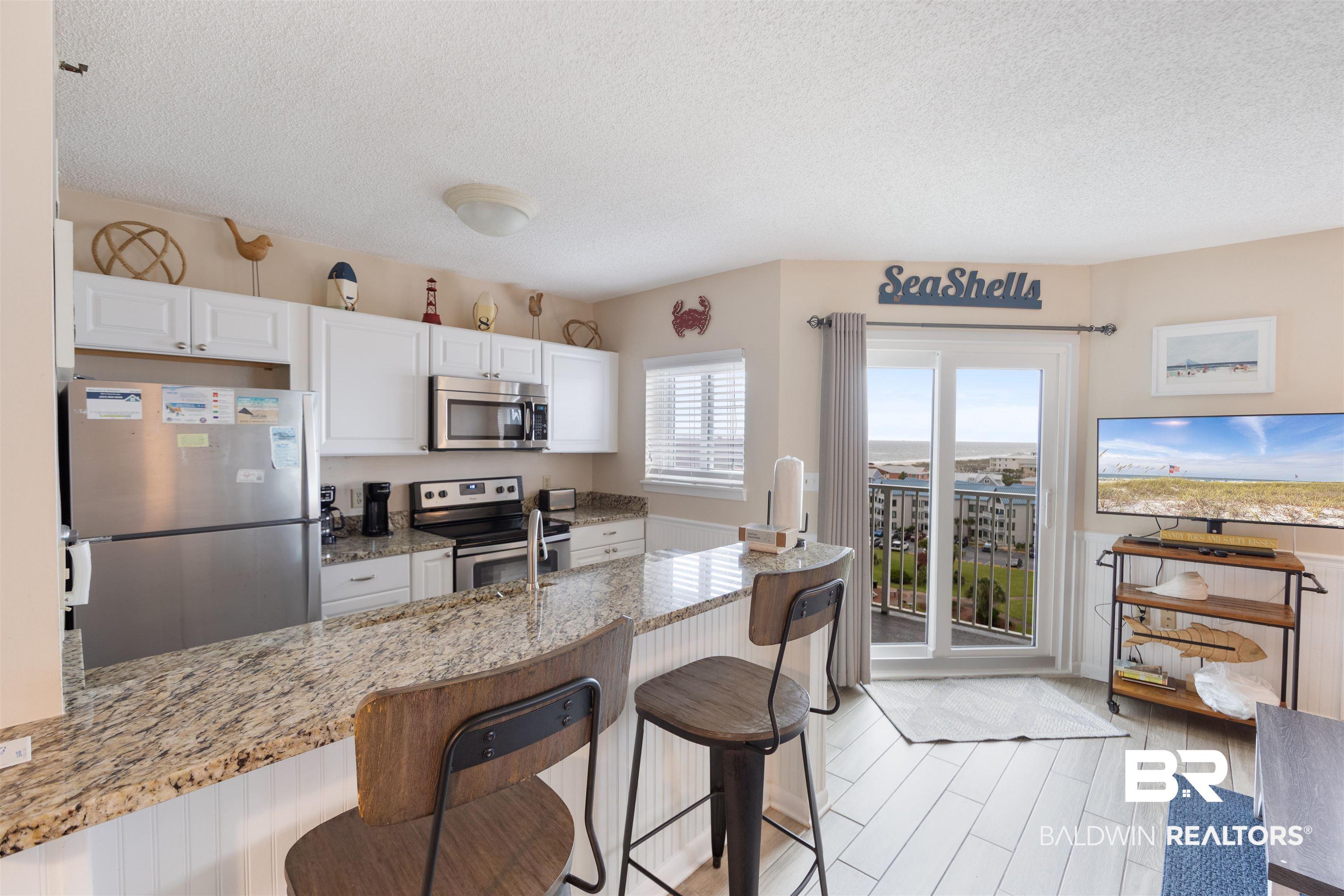 Image 3: View of Kitchen and Living Room