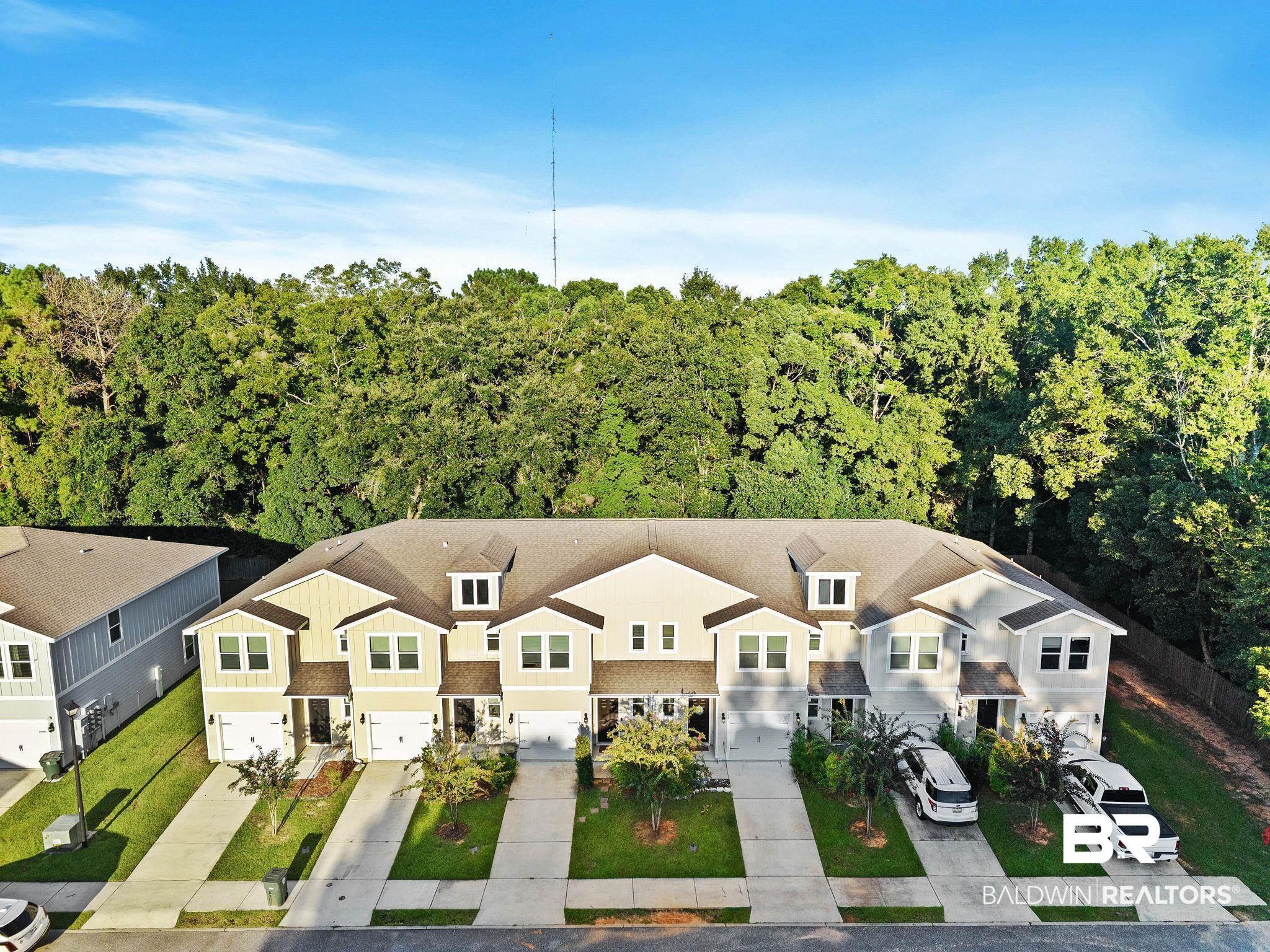 Image 3: View from above of property featuring a heavily wooded area