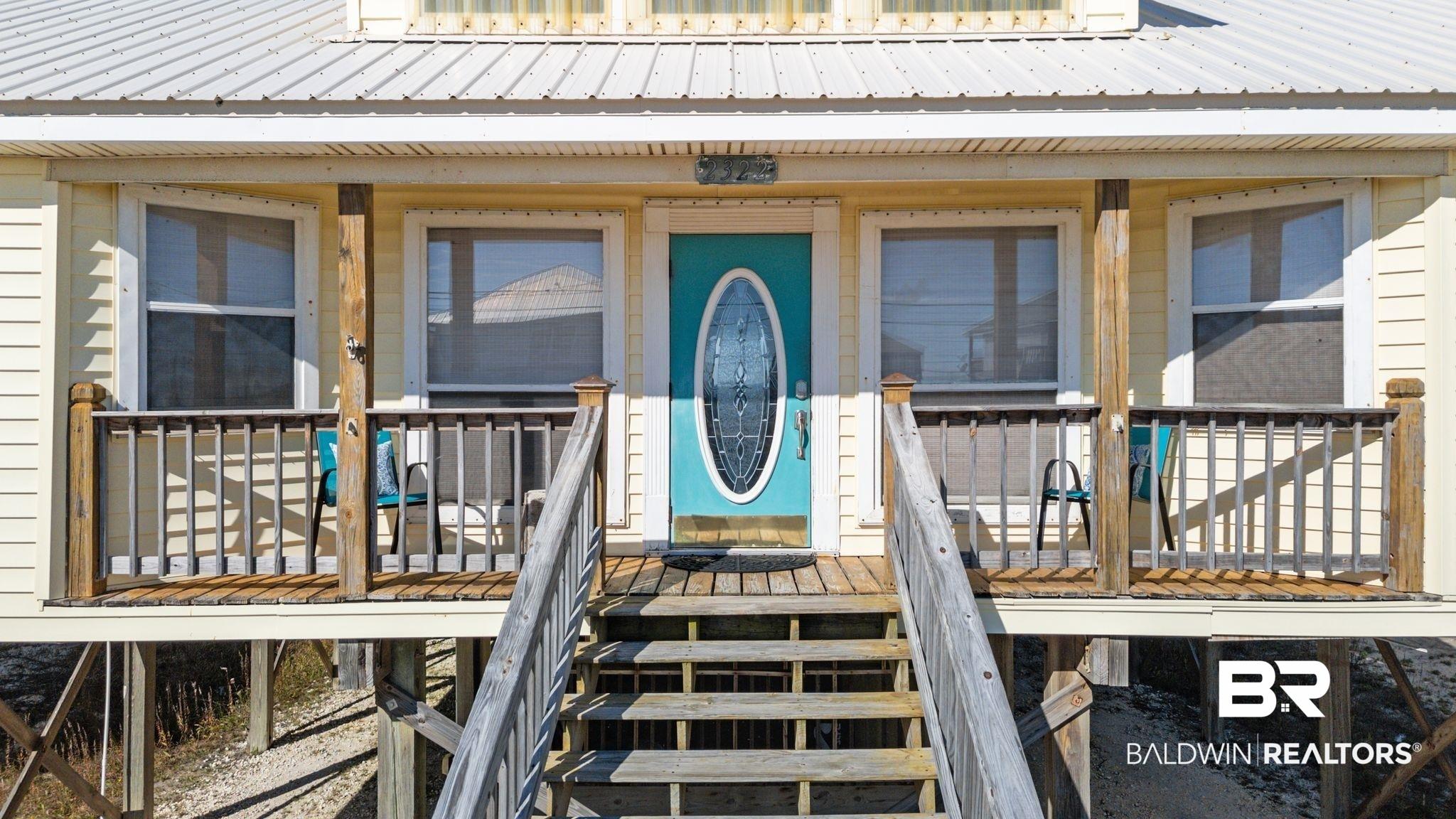 Image 3: Doorway to property featuring a metal roof