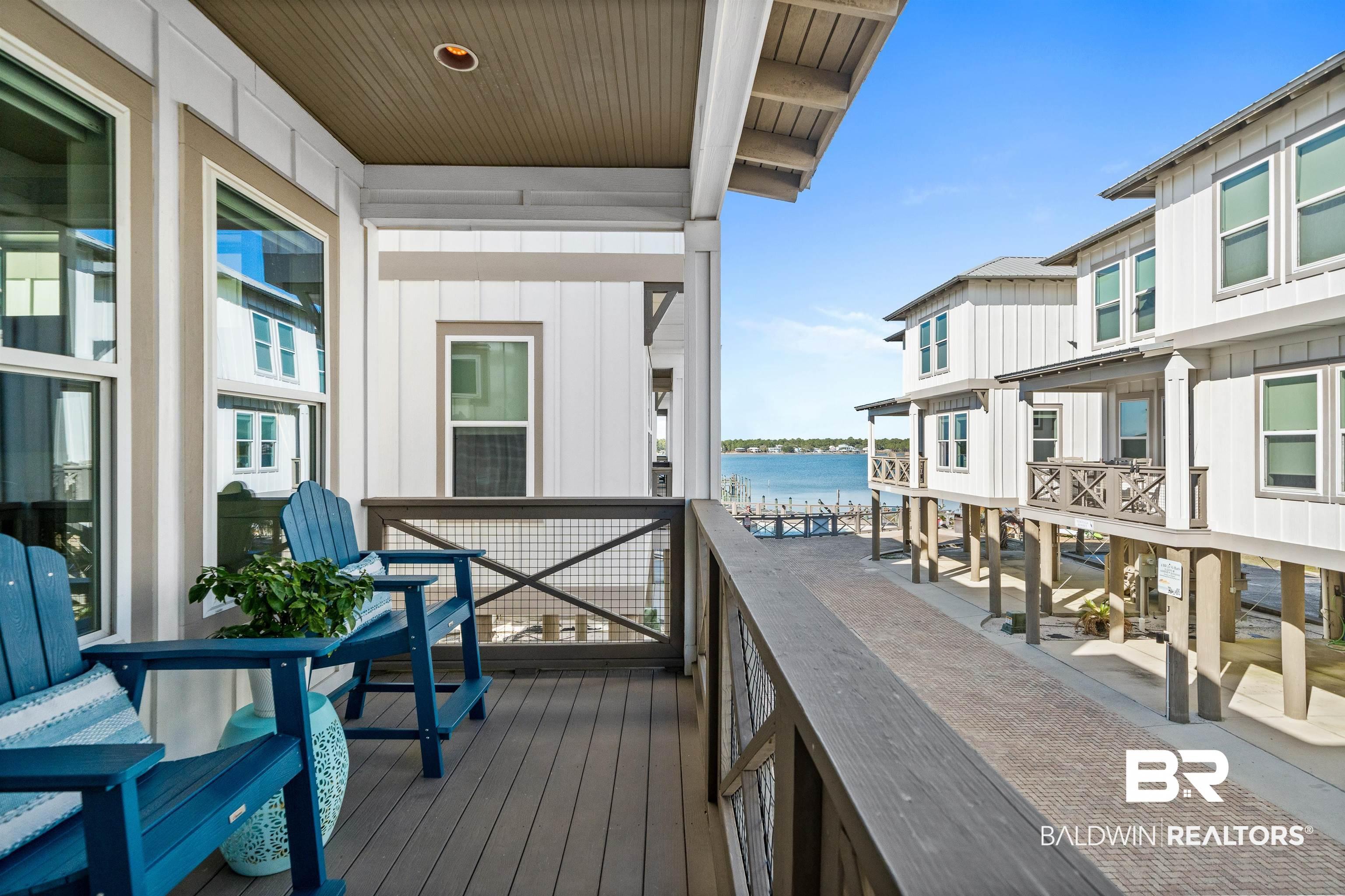 Image 3: Wooden terrace with a water view