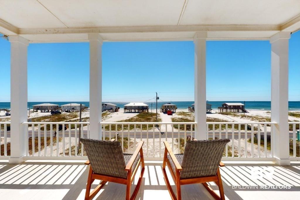 Image 3: Balcony featuring view of water and beach