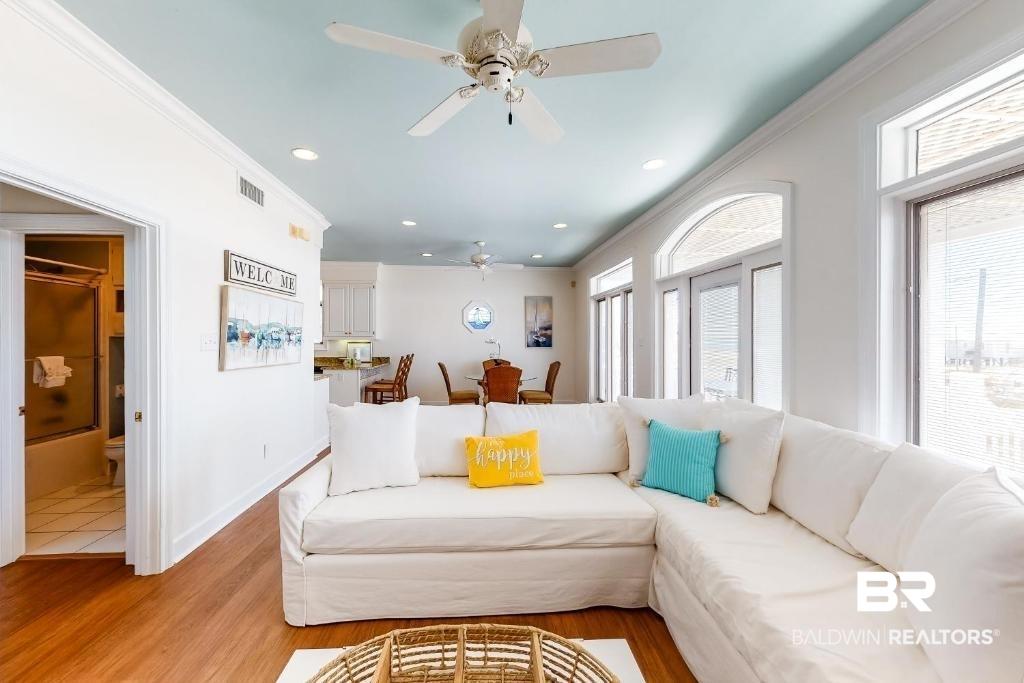 Image 4: Living area featuring recessed lighting, crown molding, light wood-type flooring, and a ceiling fan