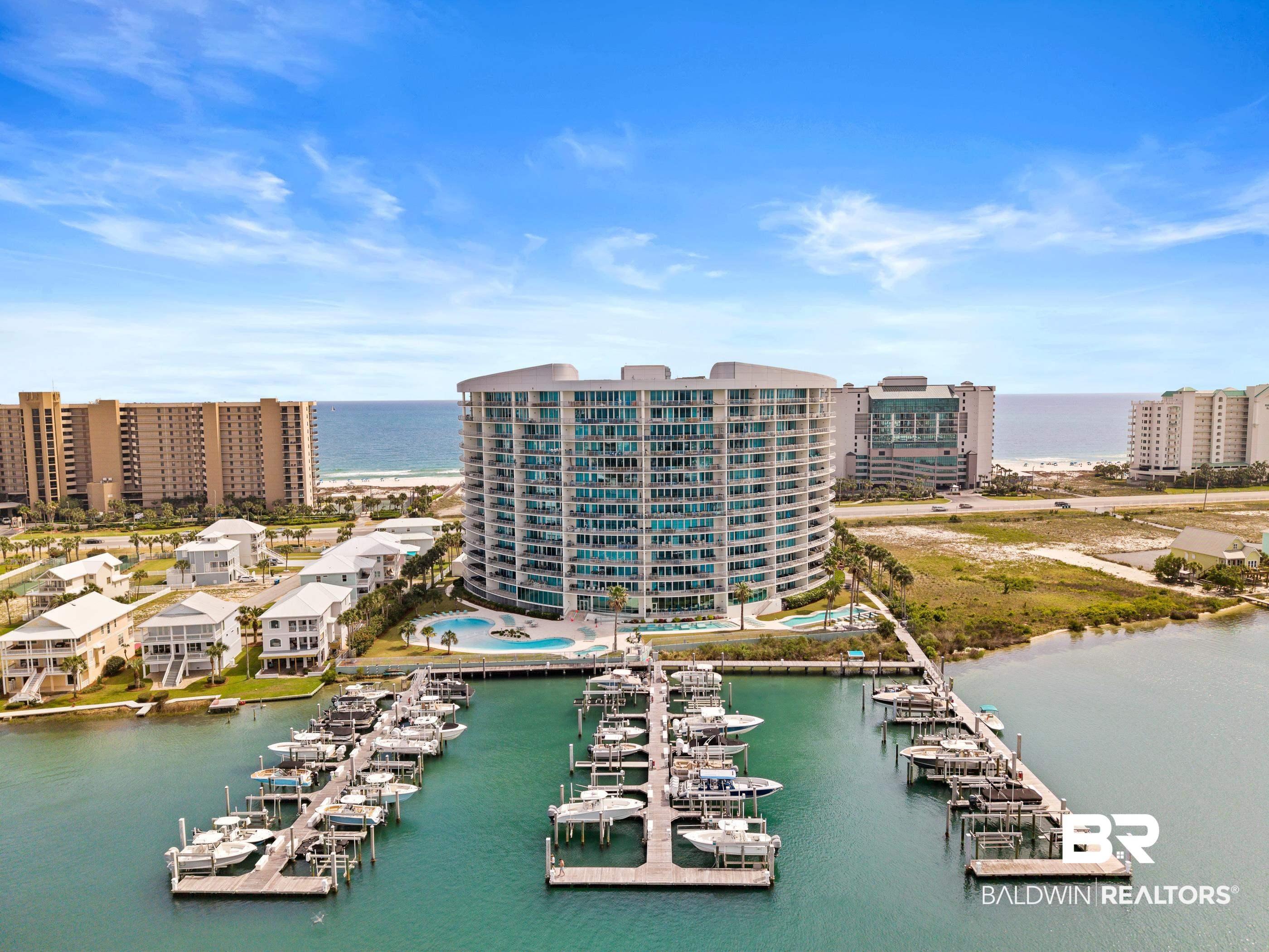 Image 2: Waterfront condominium building featuring multiple balconies