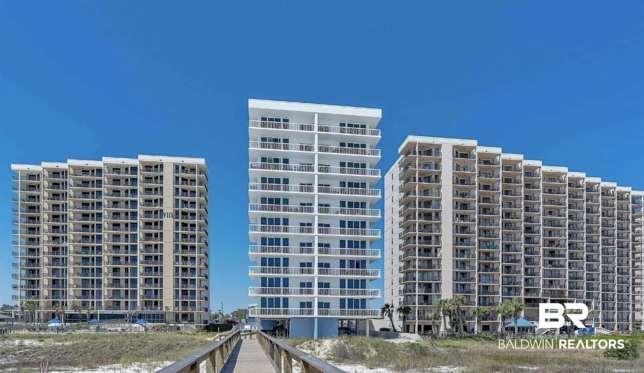 Image 1: View of apartment building / complex