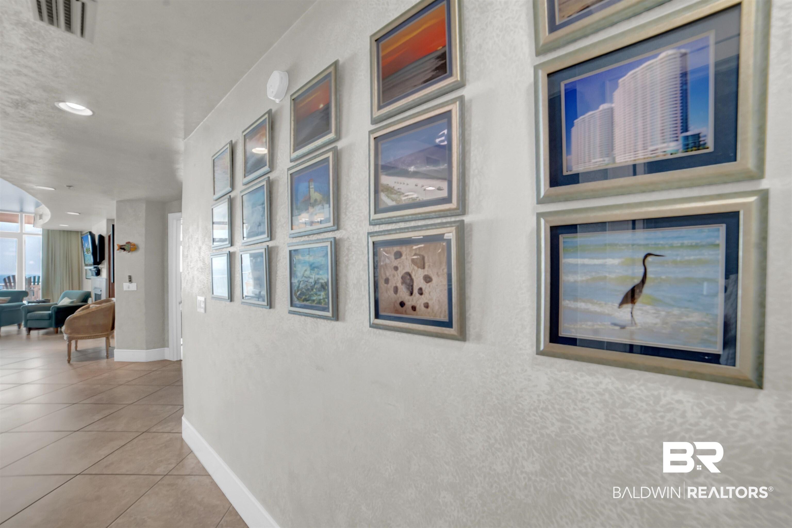 Image 3: Hall featuring light tile patterned floors and recessed lighting