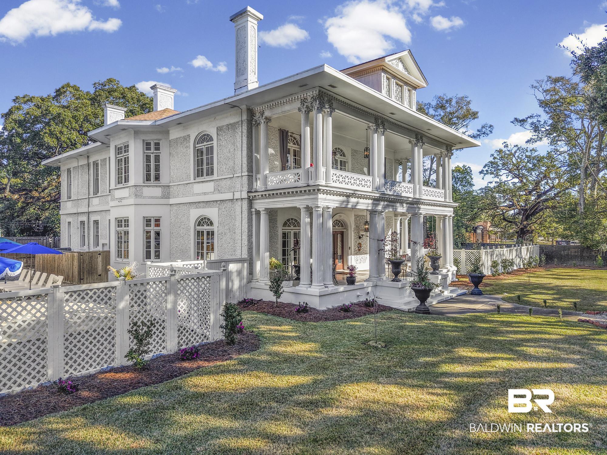 Image 3: Side view of property with a chimney and a balcony