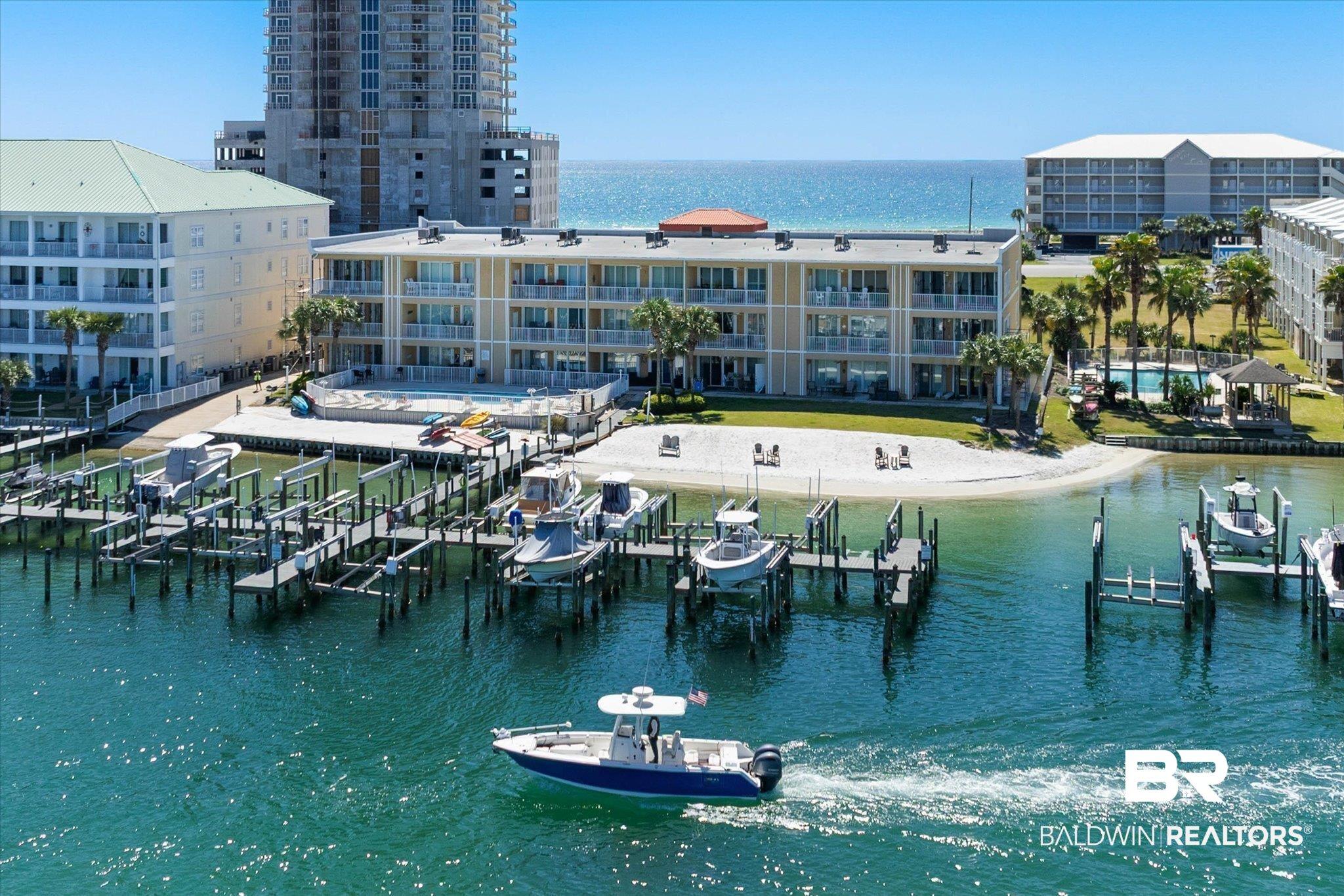 Image 1: Water view featuring boat lift and a dock