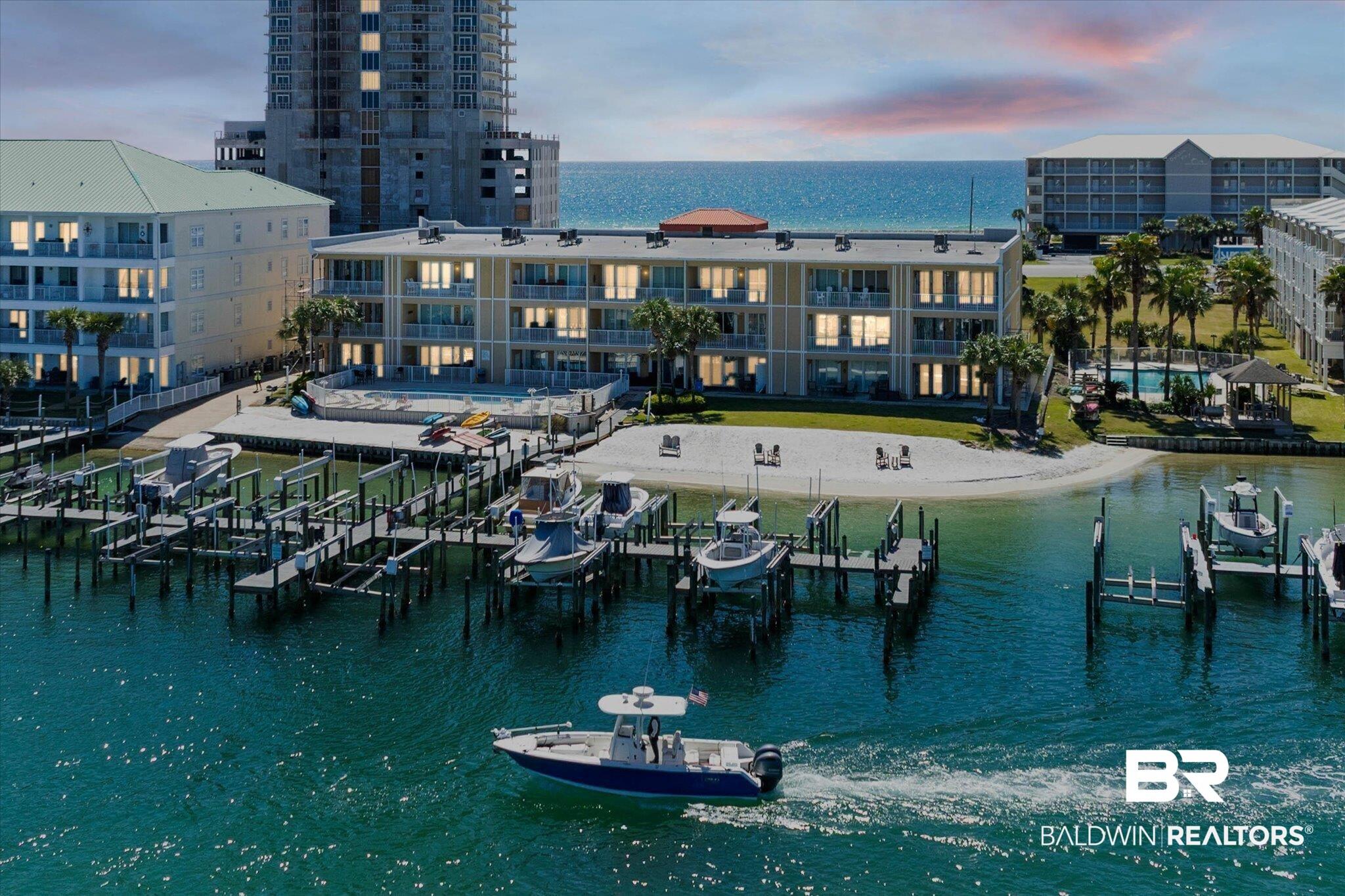 Image 3: Water view featuring a dock and boat lift
