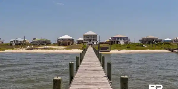 Image 3: Dock area featuring a water view and a residential view
